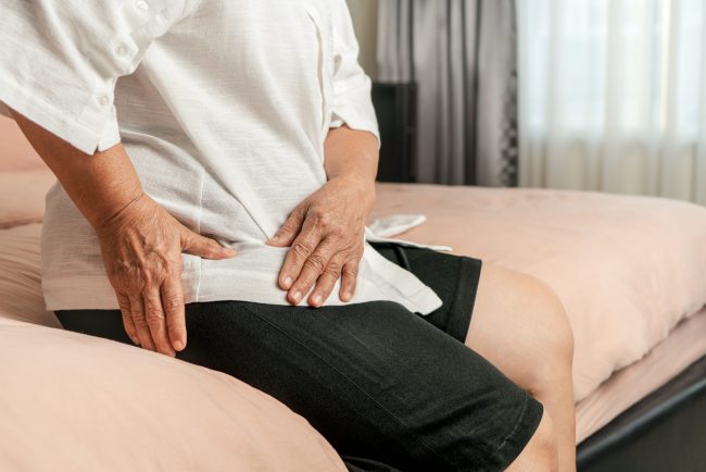 Hip pain of senior woman at home, healthcare problem of senior c